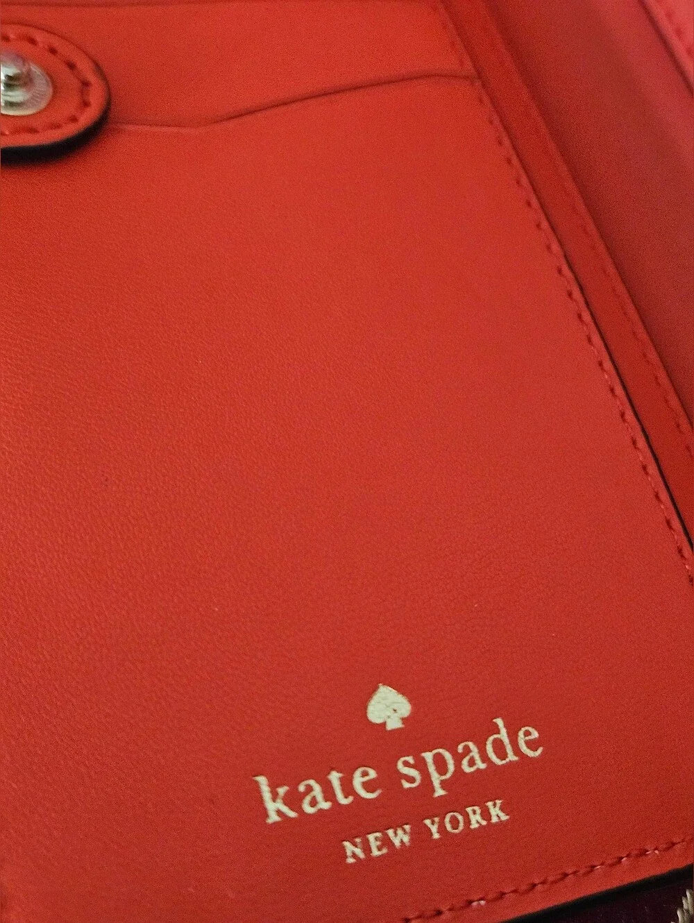 Kate Spade New York coral orange Saffiano leather continental wallet